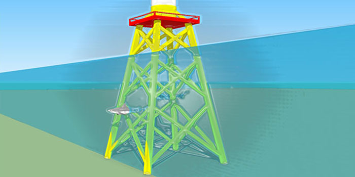 The photo shows a wind turbine and a jacket